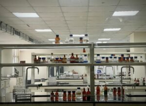 A detailed view of a modern science lab with chemical bottles and test tubes.
